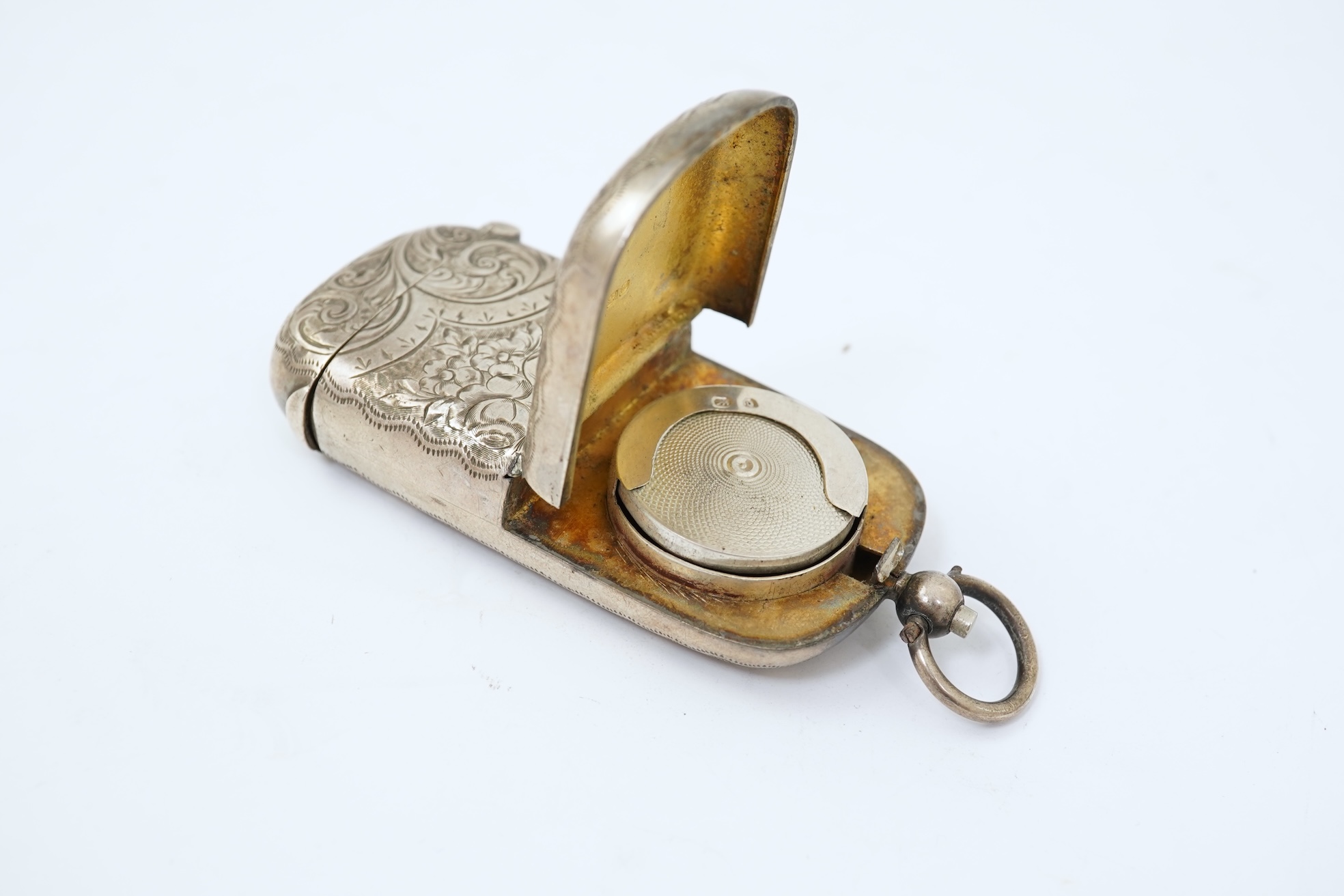 A late Victorian engraved silver oval combination sovereign and vesta case, by JW